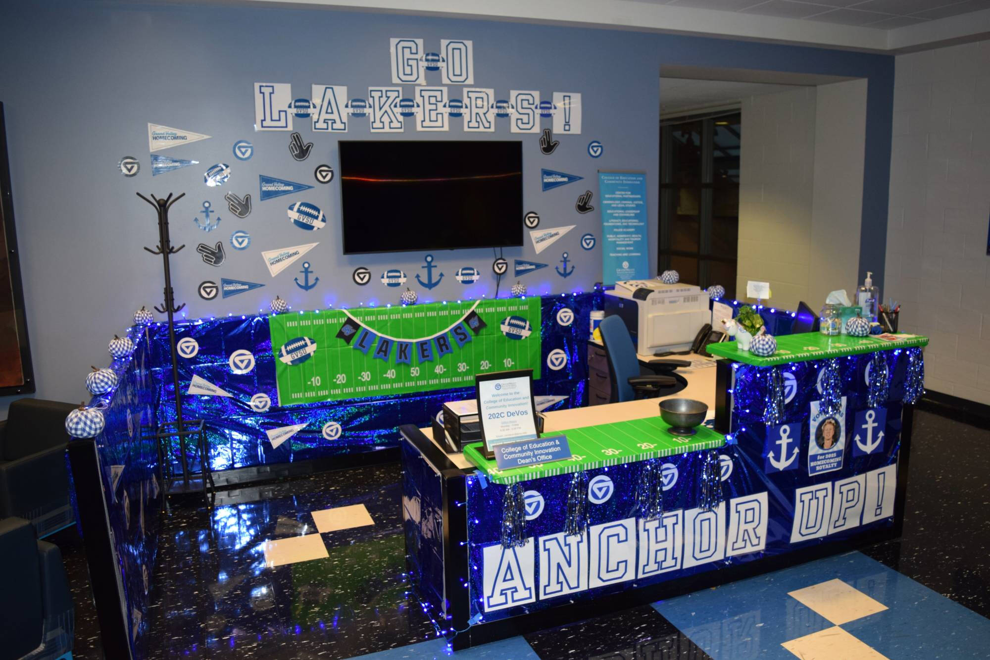 Office decorations with "Anchor Up" sign and blue streamers